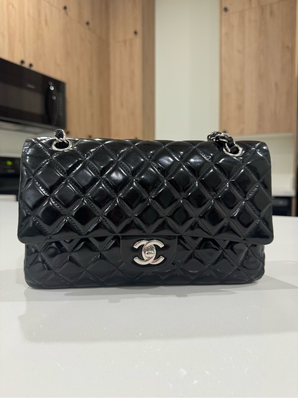 CHANEL Black Quilted Patent Leather Shoulder Bag with Silver CC Turnlock